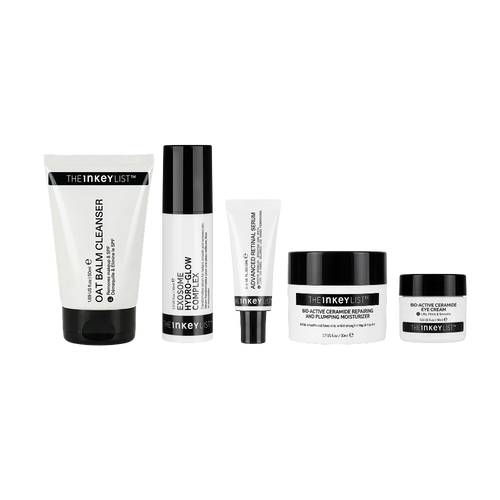 A five-piece skincare set from The Inkey List on a solid white background, including a cleanser, a serum, a toner, a cream, and a treatment jar.